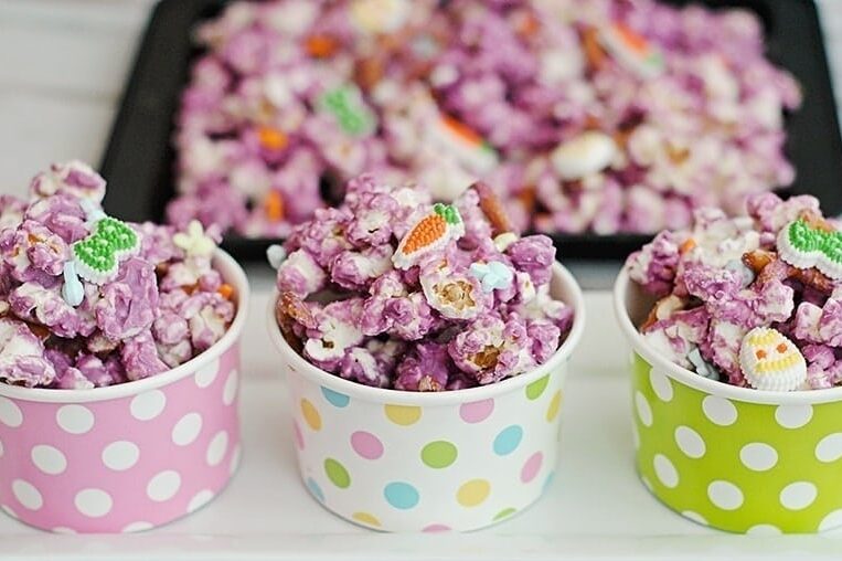 Easter dessert popcorn displayed in paper cups | The Dating Divas