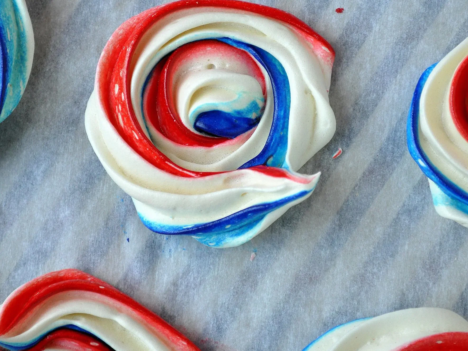 Red, white, and blue spiraled meringues make adorable 4th of July desserts. | The Dating Divas