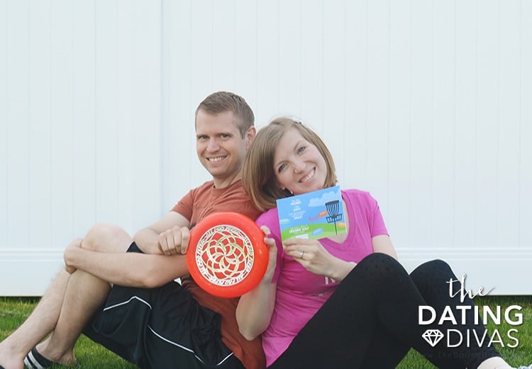 A couple playing frisbee-themed yard games for adults | The Dating Divas