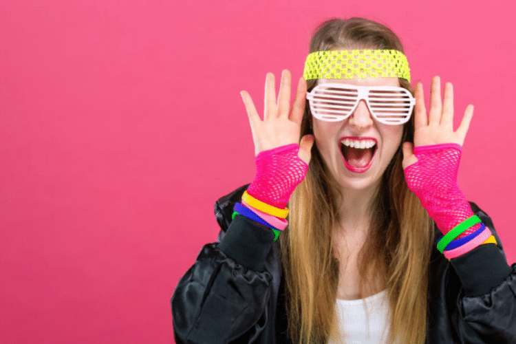 80s-themed Girls Night Out image with happy woman in 80s clothing | The Dating Divas