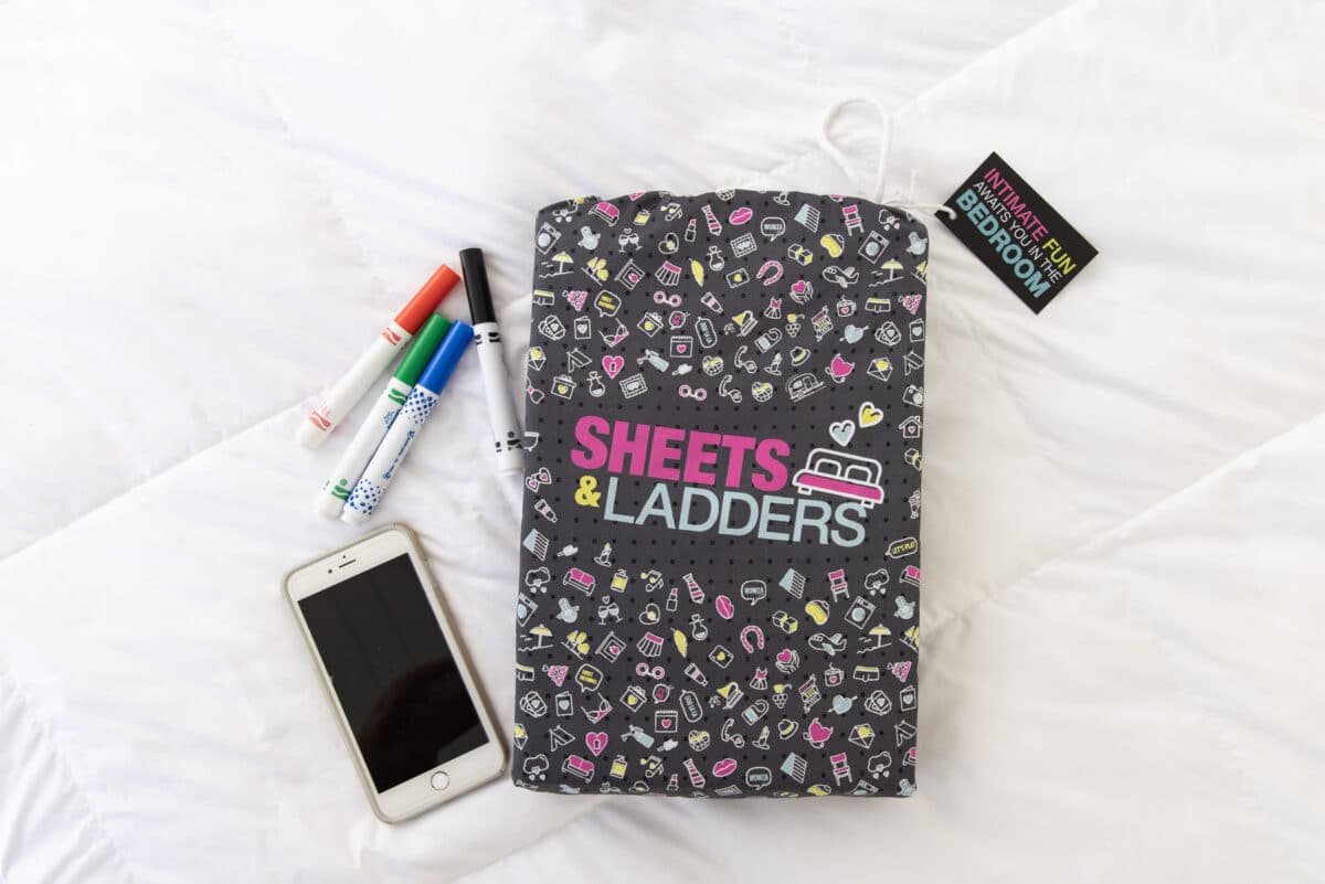 The Sheets and Ladders bedroom game kit includes a bedsheet, access to an app with foreplay ideas, and washable markers | The Dating Divas