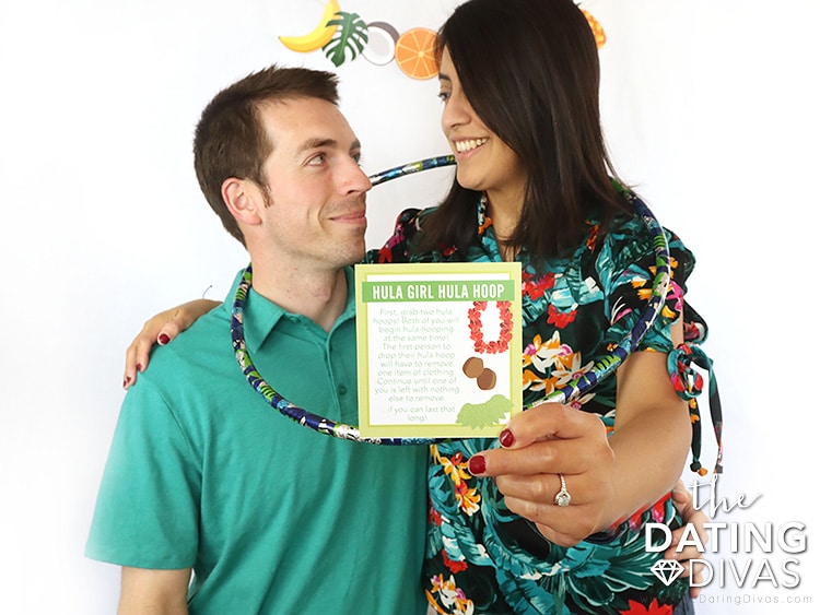 Man and woman enjoying Hawaiian-themed party ideas and games | The Dating Divas