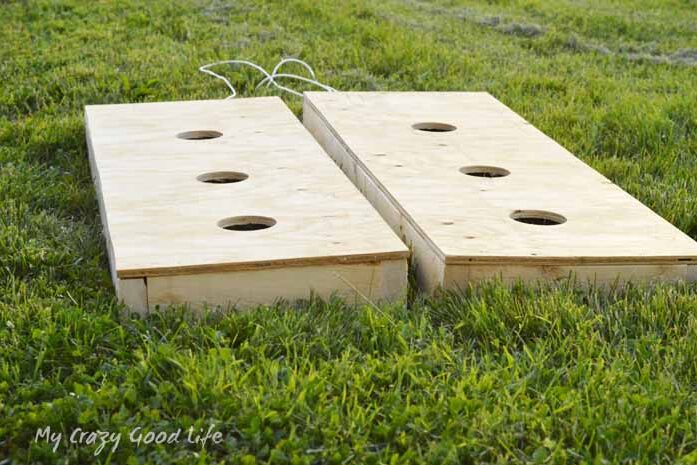 A couple of DIY outdoor game sets used to play washers | The Dating Divas 