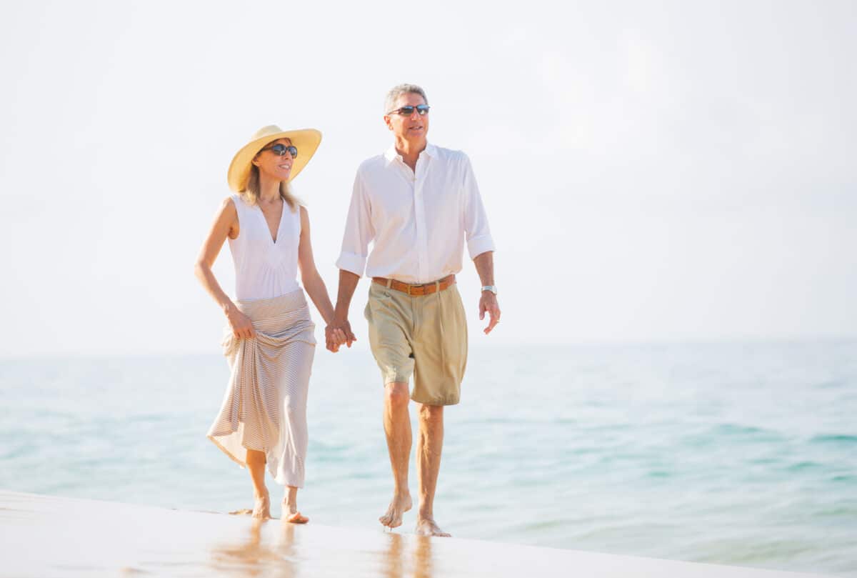 An older couple walk along the beach and talk about marriage. | The Dating Divas