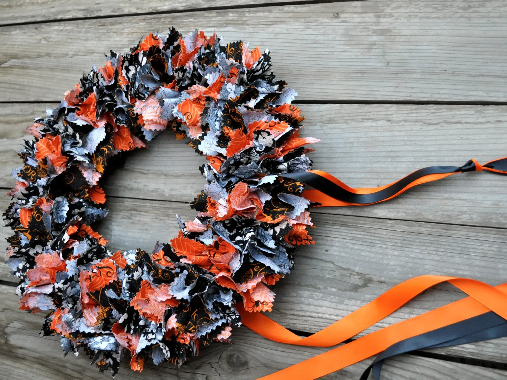 Make a fun DIY Halloween wreath using leftover scraps of fabric! | The Dating Divas