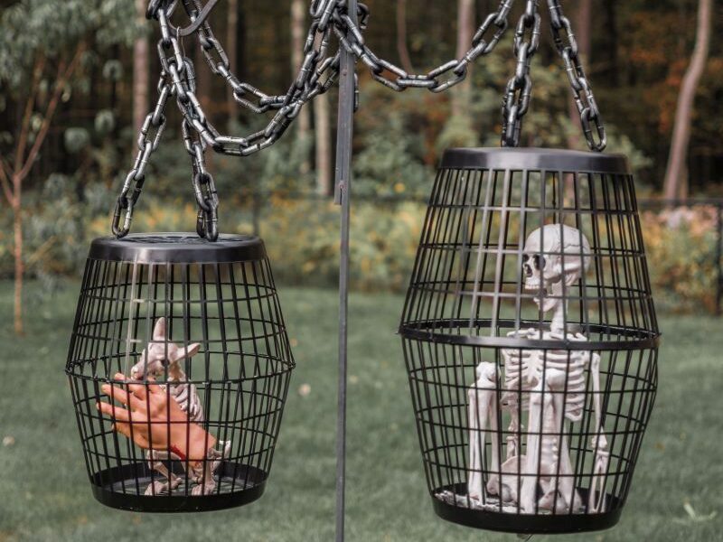 Make these inexpensive hanging cages for DIY outdoor Halloween decorations. | The Dating Divas