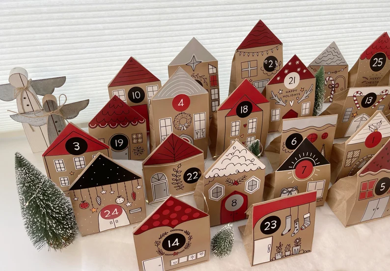 Mix your advent calendar with your Christmas village with this unique idea!  | The Dating Divas