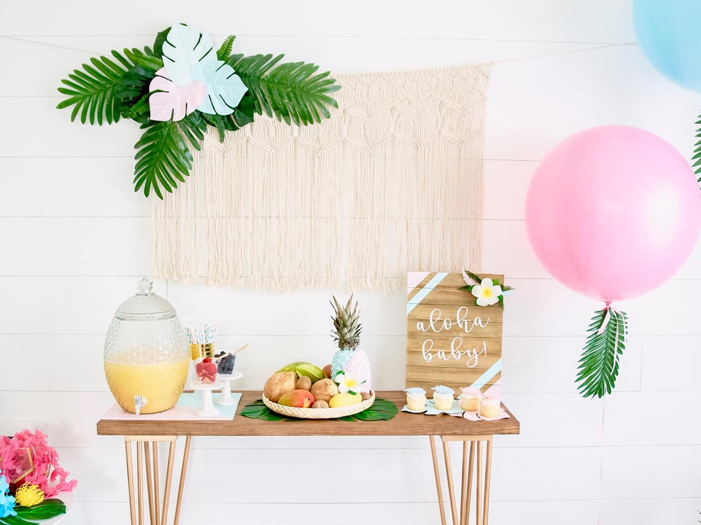 Enjoy a luau-themed gender reveal party with your guests! | The Dating Divas