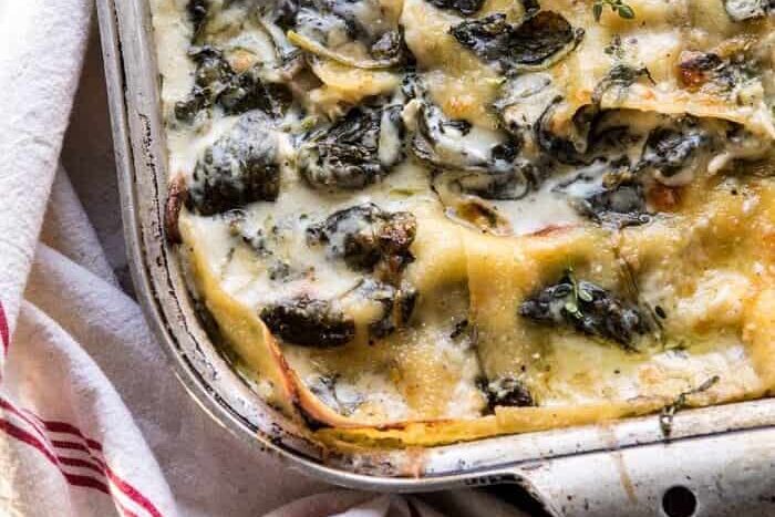 Christmas dinner ideas have never been easier to find with this list of ideas! Try this white pesto spinach lasagna. | The Dating Divas