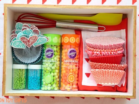 A festive, bright cupcake kit makes a perfect Christmas gift basket. | The Dating Divas