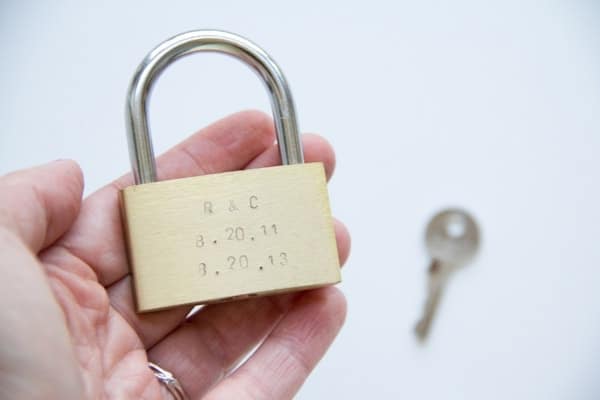 Put the date of your anniversary on a lock for a romantic and cheap Christmas gift for your spouse. | The Dating Divas
