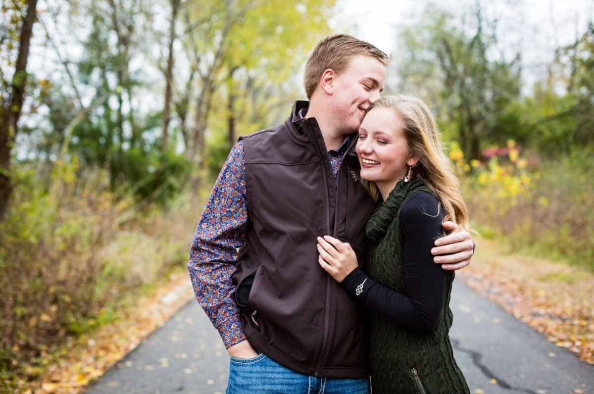 Winter engagement photos of an engaged couple on a nature trail | The Dating Divas