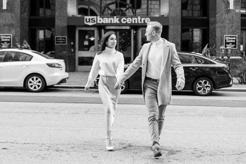 A couple walking across the street during their winter engagement photos | The Dating Divas
