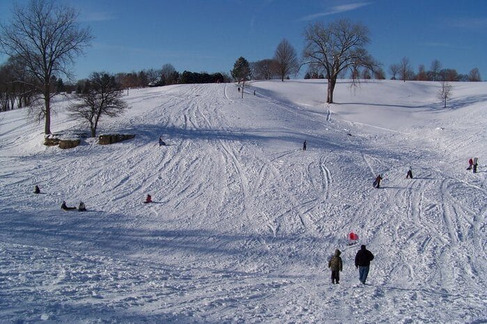 Go sledding with your family for fun winter activities! | The Dating Divas