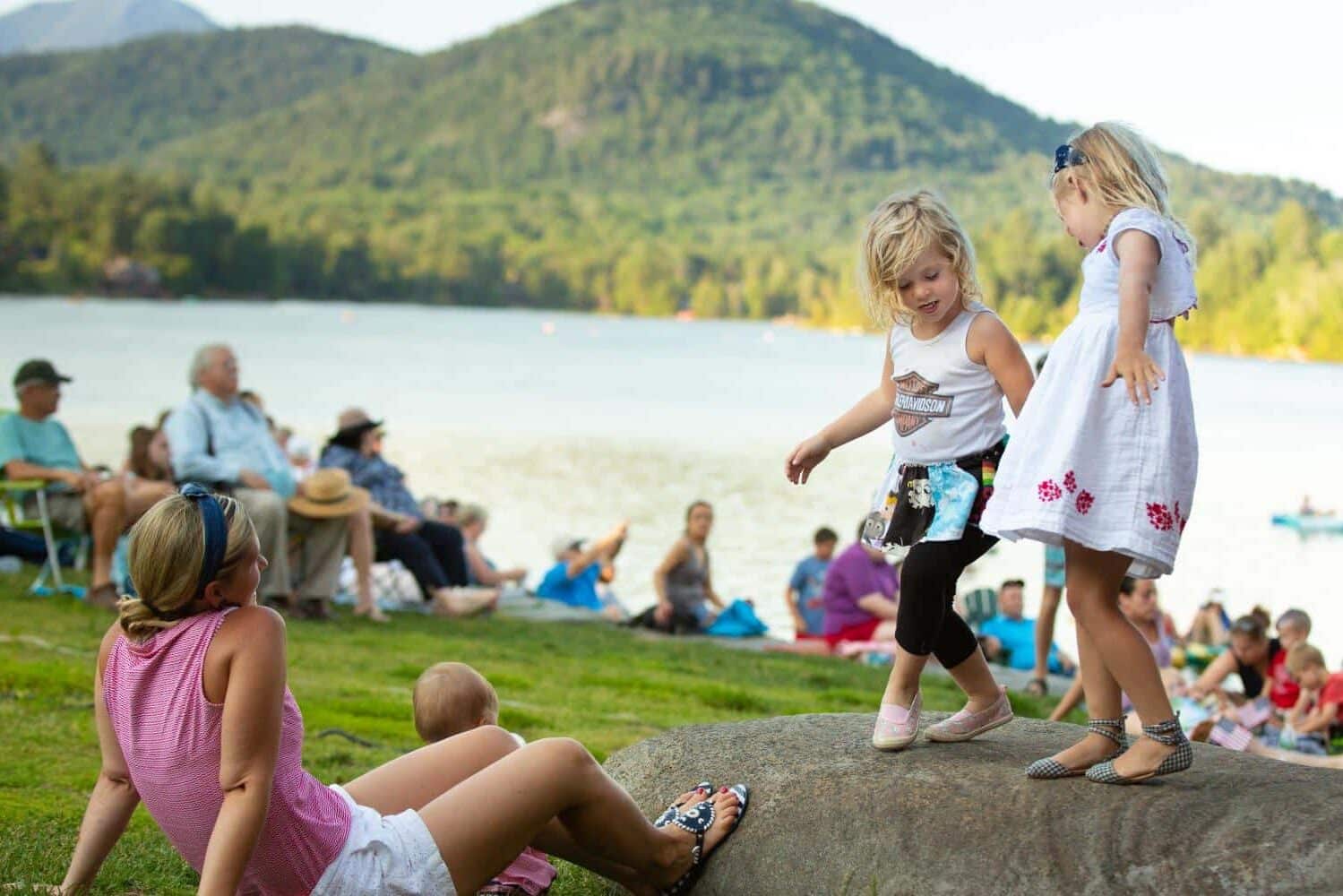 A mother and her daughters relaxing at Lake Placid, New York–one of the best spring break destinations! | The Dating Divas