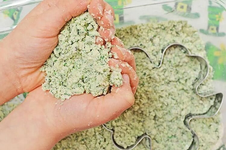 Green moon sand for St. Patrick's Day crafts and fun with kids. | The Dating Divas