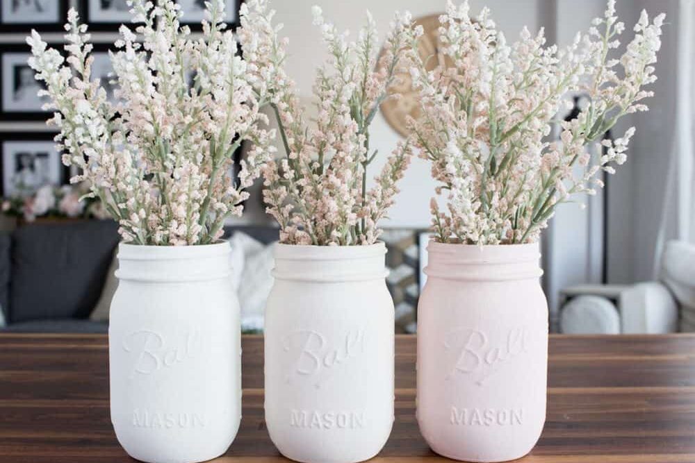 These mason jars in differing shades of blush are perfect for DIY Easter decorations! | The Dating Divas