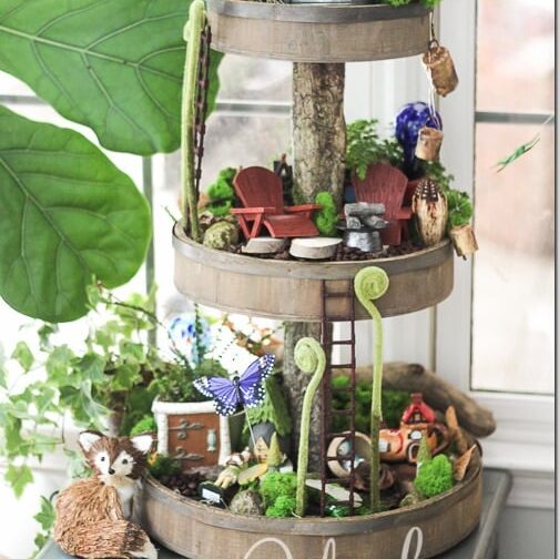 Try making this unique tiered tray fairy garden. | The Dating Divas