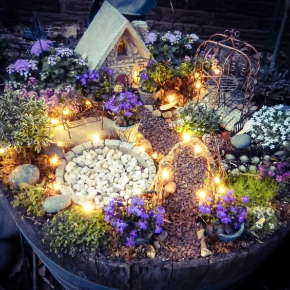 Make your fairy garden more magical by adding fairy lights! | The Dating Divas