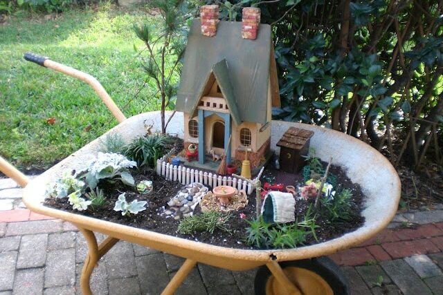 Make a fairy garden in a repurposed wheelbarrow. | The Dating Divas