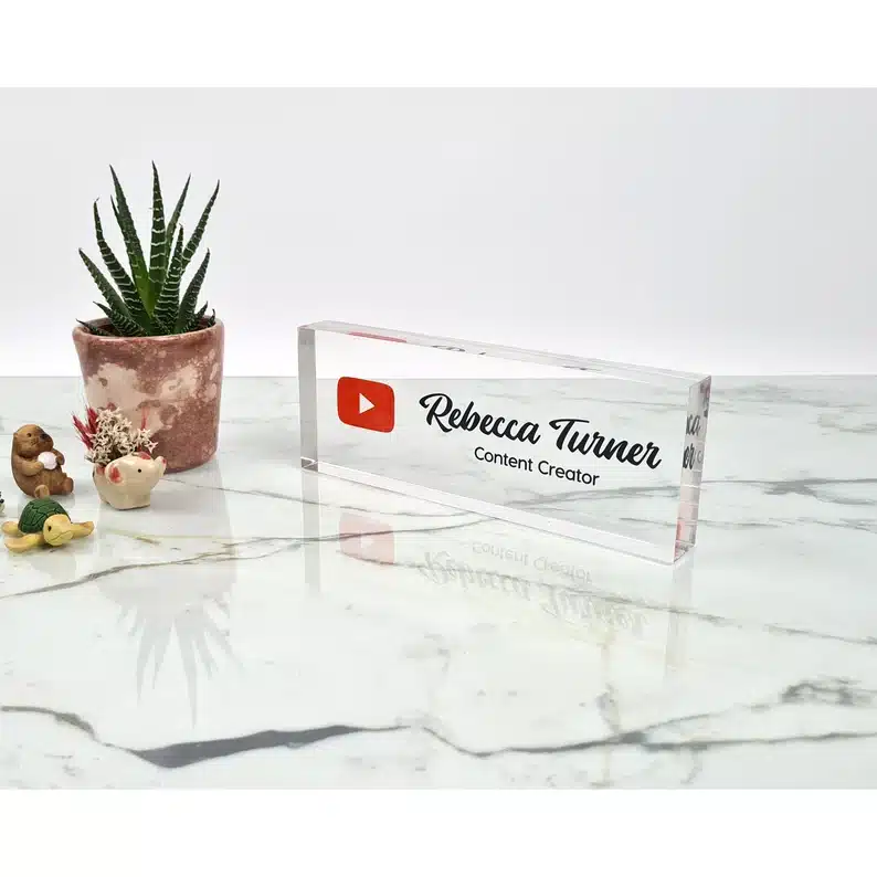 Upgrade their office decor and remind them how far they've come with this personalized nameplate as a new job gift. | The Dating Divas