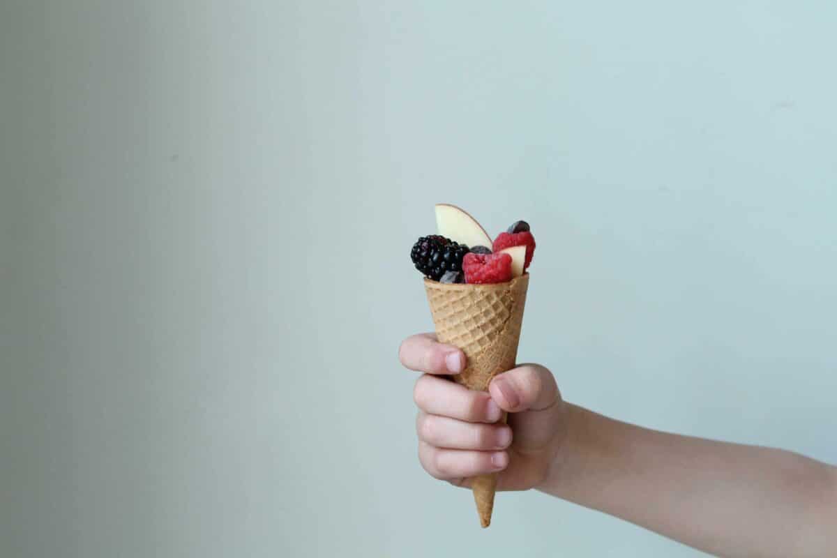 Healthy snack ideas for kindergartners are fruit-filled ice cream cones. | The Dating Divas