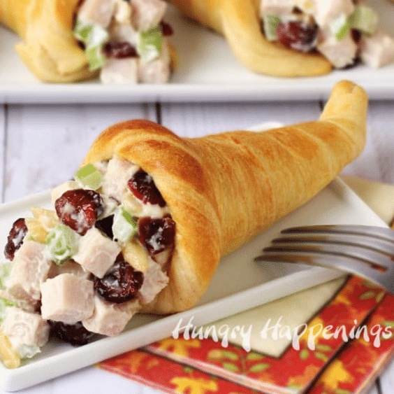 Crescent roll cornucopias will be a cute and festive addition to your Thanksgiving side dishes! | The Dating Divas 