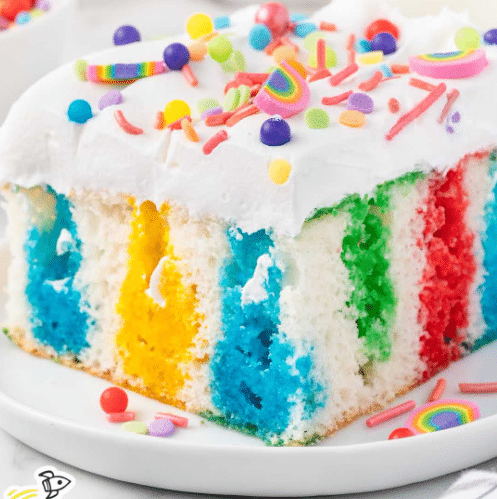 Rainbow jello cake is seriously the most perfect St. Patrick's Day party food. | The Dating Divas 