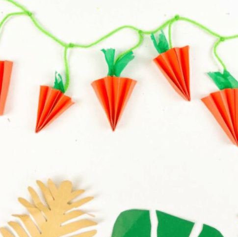 This paper carrot garland is one of the easiest Easter crafts you can make this year. | The Dating Divas 