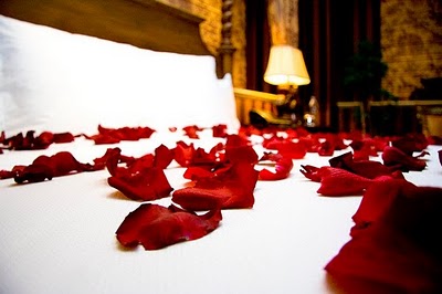 http://www.thedatingdivas.com/wp-content/uploads/Bed+with+Rose+Petals.jpg