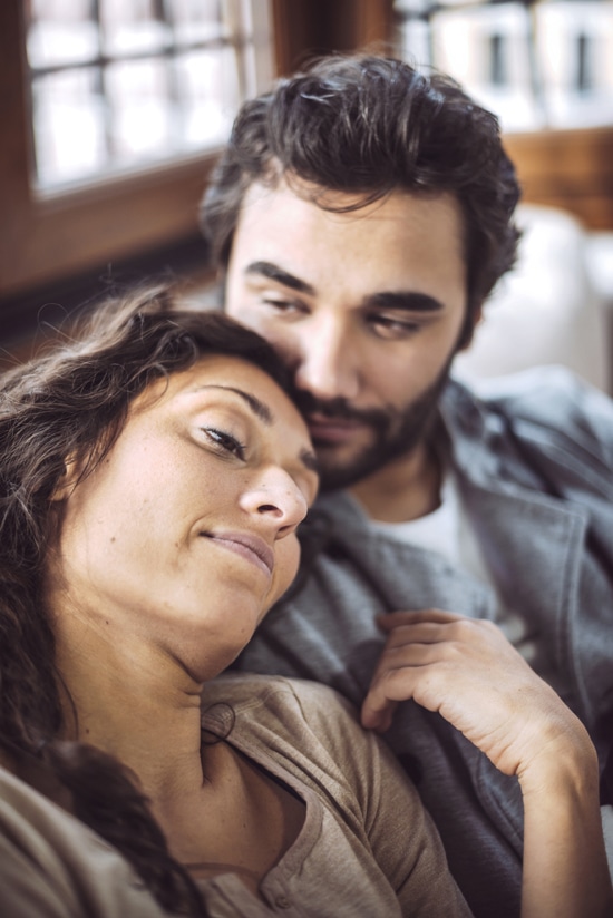 Wife leaning her head on her husbands shoulder after learning to trust again