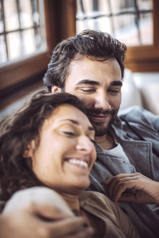 A couple smiling together after learning to trust again